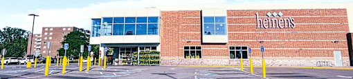 a parking lot in front of a brick building