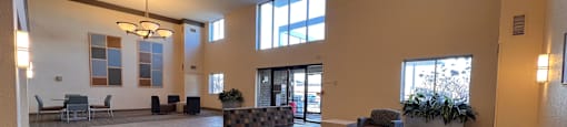 a large lobby with couches and chairs and a chandelier at Huntington Green Apartments, Ohio, 44118