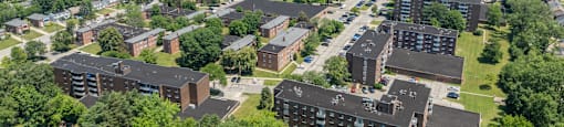A bird's eye view of a campus with buildings and trees.