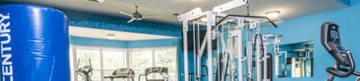 A gym with a variety of equipment including a rowing machine.at Highlands of Heritage Woods, Copley, OH 44321