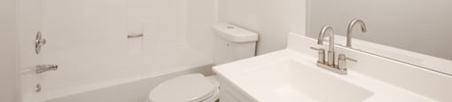 a bathroom with a sink toilet and a shower at Ascent on Peoria Apartments, Phoenix, AZ