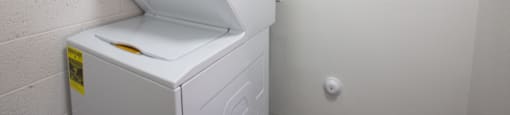 a washer and dryer in a laundry room at Ascent on Peoria Apartments, Phoenix, AZ 85029