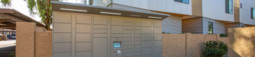 A modern house with a grey garage door in front.