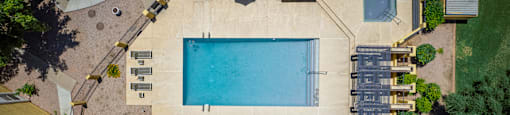 arial view of a swimming pool in a backyard with trees at Ascent on Peoria Apartments, Phoenix, AZ 85029