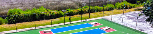 an aerial view of a basketball court on a tennis court at Planters Trace Apartment Homes, South Carolina, 29414
