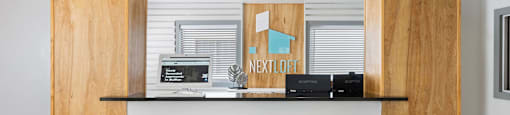 a bar with three stools in front of it at Nextloft Apartments, Bluffton, SC 29910