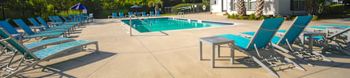 our apartments have a large pool and lounge chairs at Planters Trace Apartment Homes, Charleston, 29414