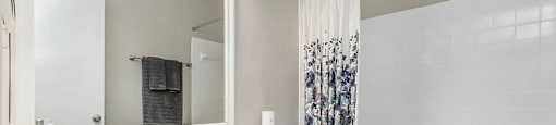 a bathroom with a sink and a toilet next to a bathtub at Planters Trace, South Carolina