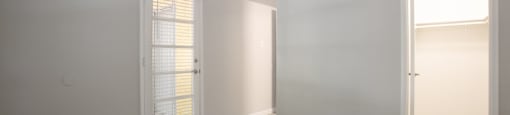 a bedroom with hardwood floors and grey walls at Ascent on Peoria Apartments, Arizona, 85029