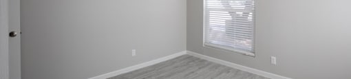a bedroom with gray walls and a window with a blind at Ascent on Peoria Apartments, Phoenix, AZ 85029