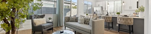 a living room with couches and chairs and a table