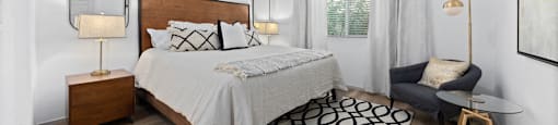 a bedroom with a bed and a ceiling fan