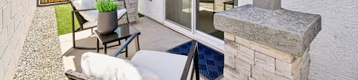 A patio with a table and chairs is shown.