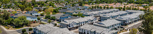 A large housing development with a mountain in the background.