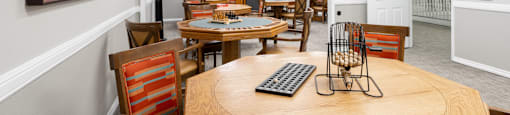 A room with a long table and chairs.