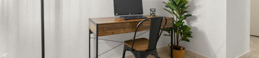 a home office with a laptop computer on a desk