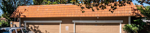2 cars in front of a garage at Oak Grove Terrace, California