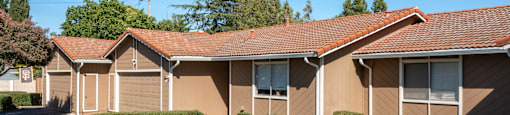 a row of brown houses with a yard and grass at Oak Grove Terrace, 94518, CA