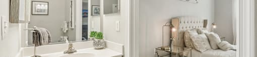 A white bathroom with a vanity and a bedroom.