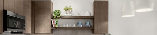 A modern kitchen with dark wood cabinets and white countertops.