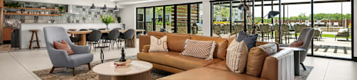 A modern living room with a wooden ceiling and a large window.
