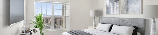 a bedroom with a bed and a window