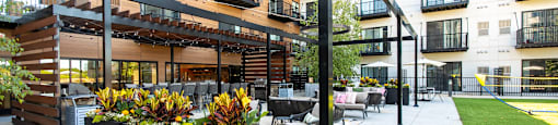 A modern building with a balcony and a planter box.