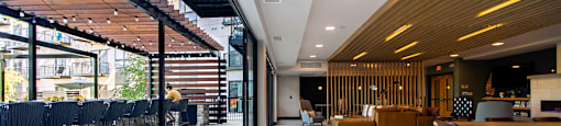 A modern open space with a long table and chairs.