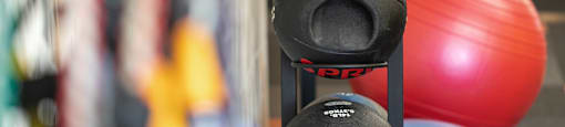 A rack of kettlebells with the word SPR on them.