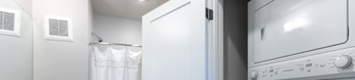 A white oven and microwave in a modern kitchen.
