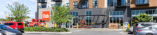 A parking lot in front of a Cub building.