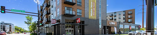 A street view of a building with the word "LOWA" on it.