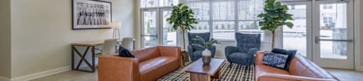 Ashland Farms Resident Clubhouse with Couch Seating, Modern Decor, and View of Pool Area