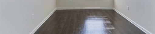 Ashland Farms Bedroom with Wood-Style Flooring, Modern Light Fixture, and Window