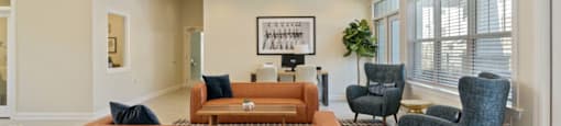 Ashland Farms Resident Clubhouse with Couch Seating, Modern Decor, and View of Pool Area
