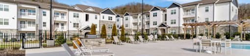 Ashland Farms Expansive Swimming Pool Area with Sundeck and Shaded Table Seating