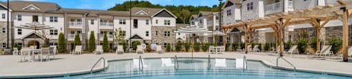 Ashland Farms Expansive Swimming Pool Area with Sundeck and Shaded Table Seating