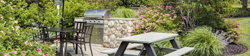 Outdoor Grilling Station with Grill, Table, and Bench