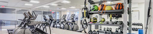 24/7 Fitness Center with Cardio Equipment, Free Weights, and Strength Training.
