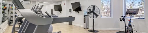 24/7 Fitness Center with Cardio Equipment, Free Weights, and Strength Training.