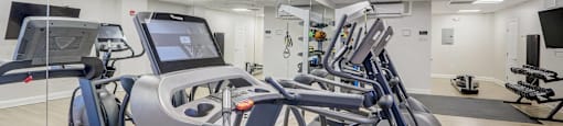 24/7 Fitness Center with Cardio Equipment, Free Weights, and Strength Training.