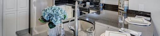 a kitchen with stainless steel appliances and a counter top