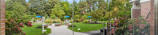 a view of a courtyard from a glass door