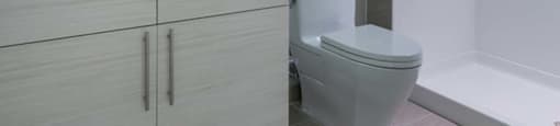A bathroom with a sink, toilet, and bathtub.