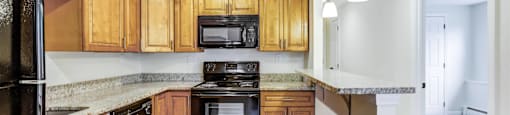 Spacious Kitchen with black appliances