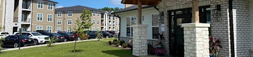 A building with a porch and a covered walkway in front of it.