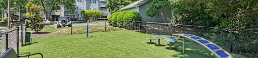 A park with a bench and a solar panel.