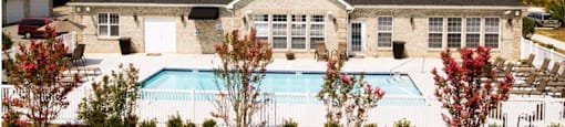 A house with a pool in the backyard.