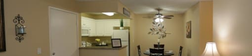 Living Room With Kitchen View at Citrus Gardens Apartments, Fontana, CA, 92335