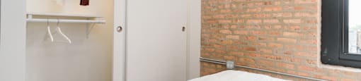 The Duncan spacious closet with sliding doors